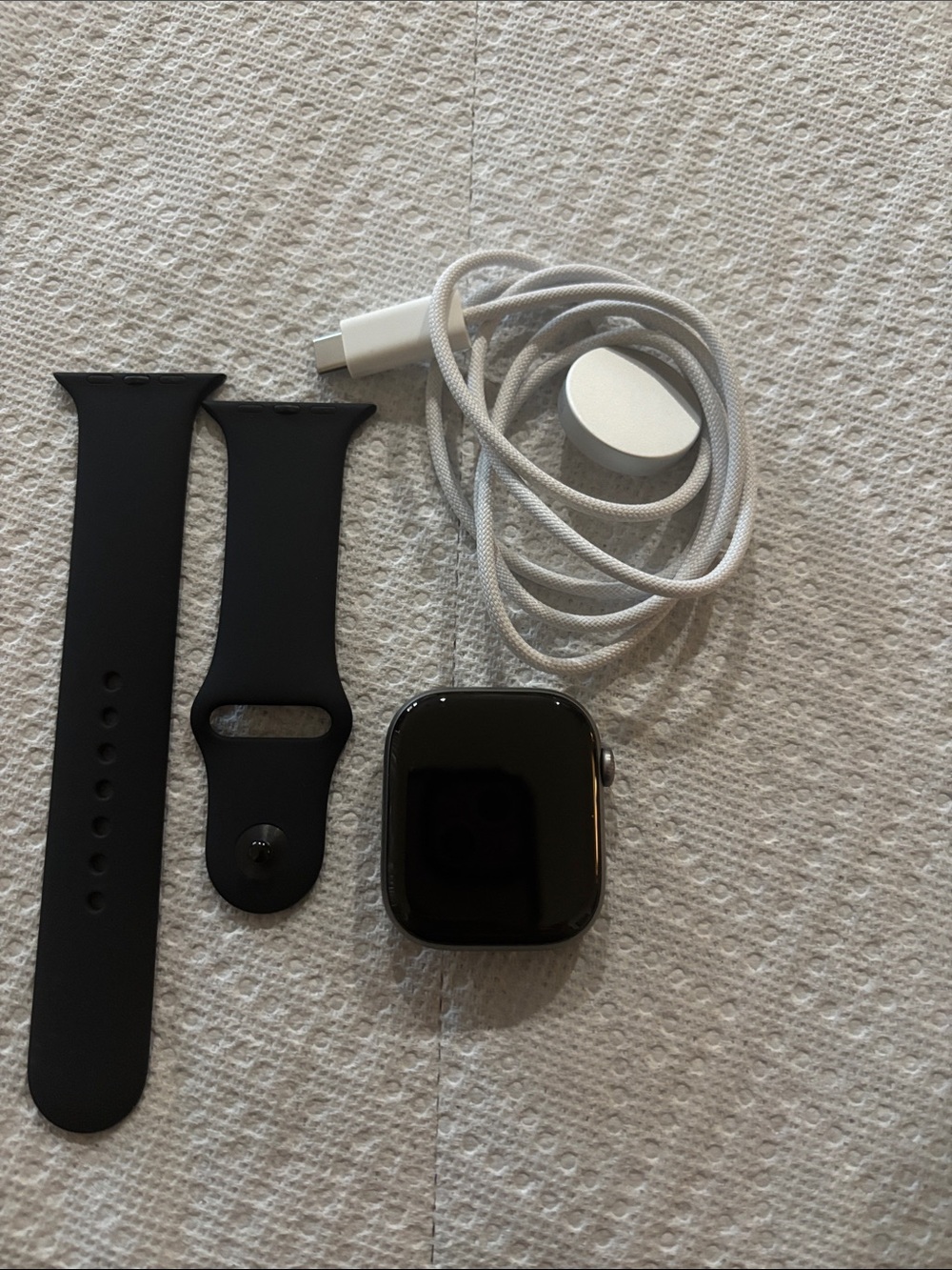 Apple Black and grey Smartwatch with Black Sport Band and White Charger Cable